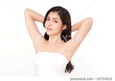Beautiful Young Asian woman lifting hands up to show off clean and hygienic armpits or underarms on white background, Smooth armpit cleanliness and protection concept 93734016