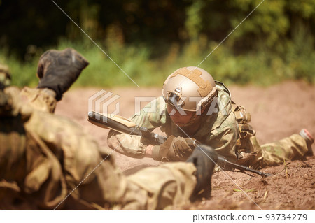 Special forces soldier with weapon take part in military maneuver. War, army, technology and people concept Special forces soldier with weapon take part in military maneuver. War, army, technology and people concept 93734279