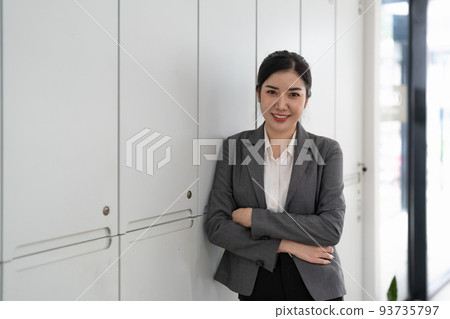 Entrepreneur young asian woman, business woman arms crossed at her office. 93735797