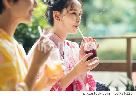 Woman drinking juice in yukata 93736126
