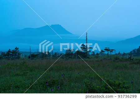 foggy early morning landscape on Kunashir island with a view of the volcano foggy early morning landscape on Kunashir island with a view of the volcano 93736299