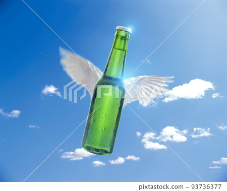 flying Green beer bottle on sun and sky background, sales ideas for advertising flying Green beer bottle on sun and sky background, sales ideas for advertising 93736377