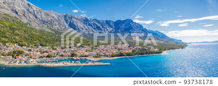 Panorama of Baska Voda town with harbor against mountains in Makarska riviera, Dalmatia, Croatia Panorama of Baska Voda town with harbor against mountains in Makarska riviera, Dalmatia, Croatia 93738178