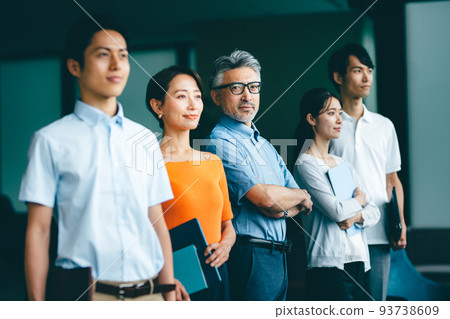 Office workers looking in the same direction Office workers looking in the same direction 93738609
