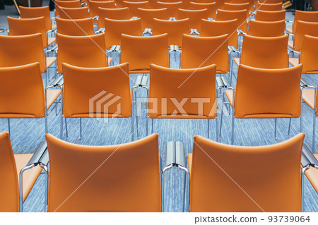 large empty conference room with orange chairs before the auction large empty conference room with orange chairs before the auction 93739064