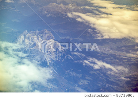 the tame emperor in the Kaiser mountains of the Alps, in the Austrian Tyrol, photographed from above from the air from an airplane 93739903