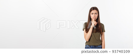 Beautiful woman showing finger over lips isolated on a white background. Beautiful woman showing finger over lips isolated on a white background. 93740109