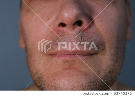 Middle-aged man face fragment, half man face, close up portrait of a middle aged man on grey background, 93740376