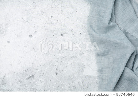 Grey background with grey textile napkin. 93740646