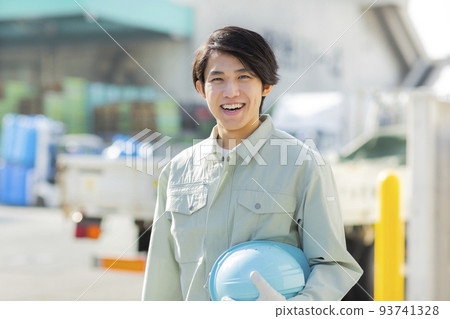 A young man working on clothes 93741328