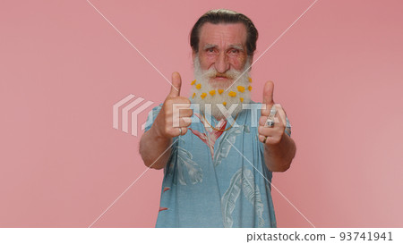 Senior man raises thumbs up agrees or gives positive reply recommends advertisement likes good Senior man raises thumbs up agrees or gives positive reply recommends advertisement likes good 93741941