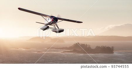 Seaplane Flying over the West Coast Pacific Ocean. Adventure Composite. 93744555