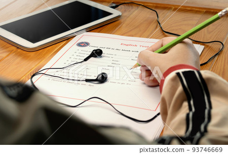English listening test on wooden desk 93746669