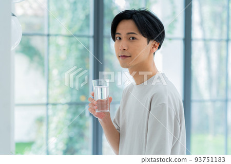 Young man with a cup 93751183