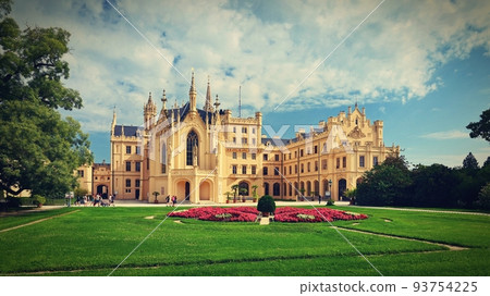 Lednice Chateau with beautiful gardens and parks on sunny summer day. Lednice-Valtice Landscape, South Moravian region. UNESCO World Heritage Site. Beautiful old romantic castle. 93754225