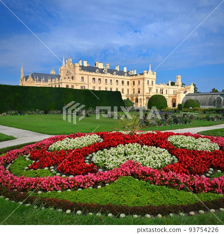Lednice Chateau with beautiful gardens and parks on sunny summer day. Lednice-Valtice Landscape, South Moravian region. UNESCO World Heritage Site. Beautiful old romantic castle. Lednice Chateau with beautiful gardens and parks on sunny summer day. Lednice-Valtice Landscape, South Moravian region. UNESCO World Heritage Site. Beautiful old romantic castle. 93754226