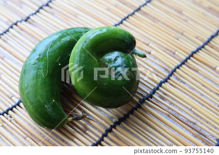 Deformed and bent cucumber harvested from the kitchen garden 93755140