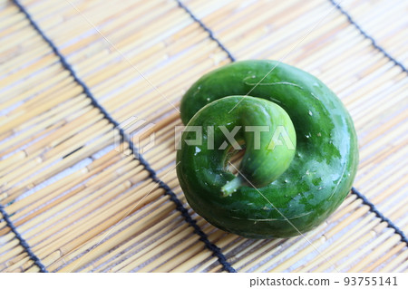 Deformed and bent cucumber harvested from the kitchen garden Deformed and bent cucumber harvested from the kitchen garden 93755141