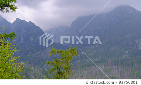 Blue haze in the mountains before the storm. Vysoke Tatry, High Tatras mountain view at Hrebienok, Stary Smokovec, in summer. High Tatras mountain, Slovakia 93756801