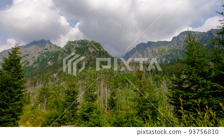 Blue haze in the mountains before the storm. Vysoke Tatry, High Tatras mountain view at Hrebienok, Stary Smokovec, in summer. High Tatras mountain, Slovakia Blue haze in the mountains before the storm. Vysoke Tatry, High Tatras mountain view at Hrebienok, Stary Smokovec, in summer. High Tatras mountain, Slovakia 93756810