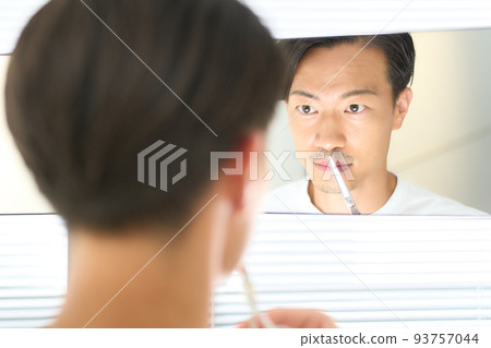 Young man cutting beard with scissors men's beauty image Young man cutting beard with scissors men's beauty image 93757044
