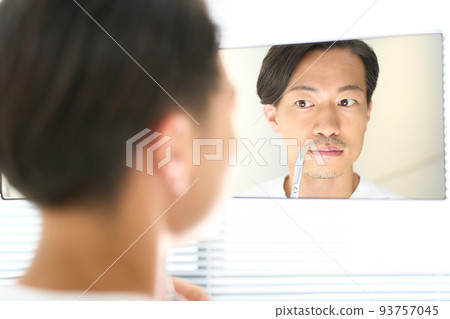 Young man cutting beard with scissors men's beauty image Young man cutting beard with scissors men's beauty image 93757045