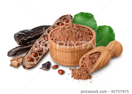 Carob pod and powder in wooden bowl isolated on white background with full depth of field. Carob pod and powder in wooden bowl isolated on white background with full depth of field. 93757975