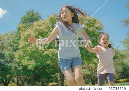 Girl up running holding hands 93758539