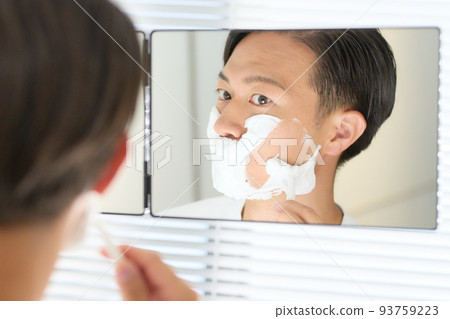 Man shaving with a razor Men's beauty image 93759223
