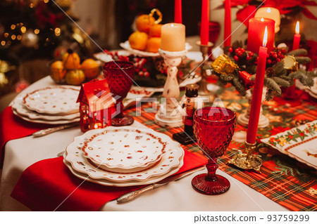 Christmas serving at home on the background of the Christmas tree. Christmas serving at home on the background of the Christmas tree. 93759299