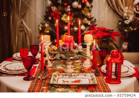 Christmas serving at home on the background of the Christmas tree. Christmas serving at home on the background of the Christmas tree. 93759424