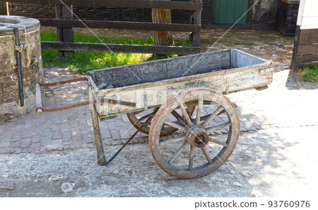 Old empty cart in a vintage street 93760976