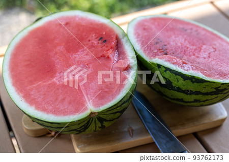 Cut the watermelon on the veranda Cut the watermelon on the veranda 93762173