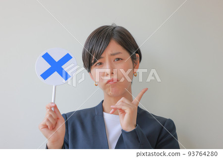 A woman holding an X plate and raising her index finger 2 93764280