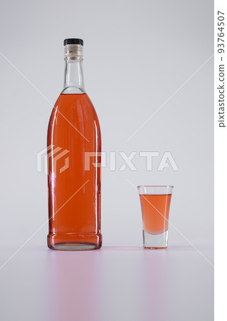 strong alcohol drink, colored tincture or whiskey, rum, vermouth, brandy, cognac 93764507
