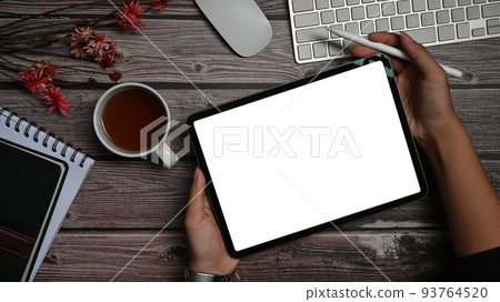 Top view digital tablet with empty display, notebook and supplies on wooden office desk 93764520