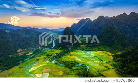 Aerial view of limestone mountains and rice field at sunset in Vang vieng, Laos. 93765806