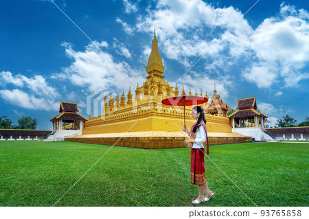 Asian woman wearing laos traditional at Phra that luang in Vientiane, Laos. Asian woman wearing laos traditional at Phra that luang in Vientiane, Laos. 93765858
