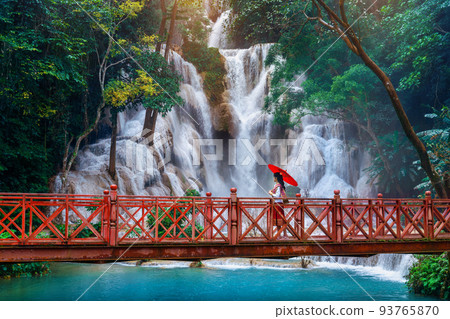Woman walking at Kuang Si waterfall in Luang Prabang, Laos. 93765870
