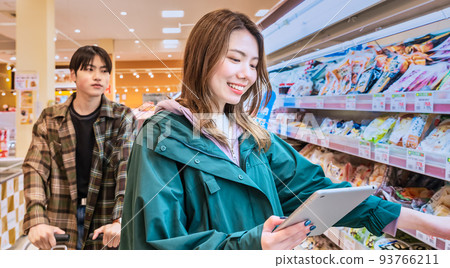 Young people shopping at the supermarket Young people shopping at the supermarket 93766211