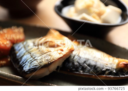 Grilled mackerel served in a Japanese-style ceramic bowl Grilled mackerel served in a Japanese-style ceramic bowl 93766725