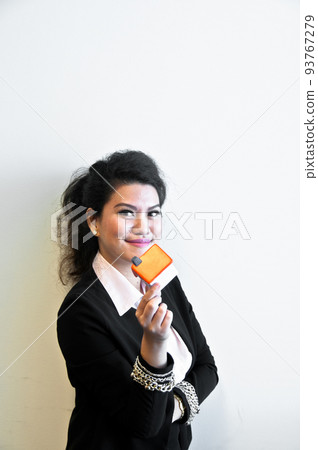 Business woman hold house toy model on white background Business woman hold house toy model on white background 93767279