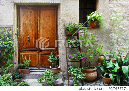 Charming floral narrow streets of typical italian villages. Spello in Umbria 93767717