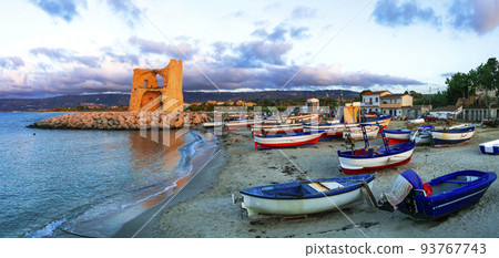 Picturesque beach scenery with tradtional fishing boats and saracen tower in Calabria. Landmarks of south Italy 93767743