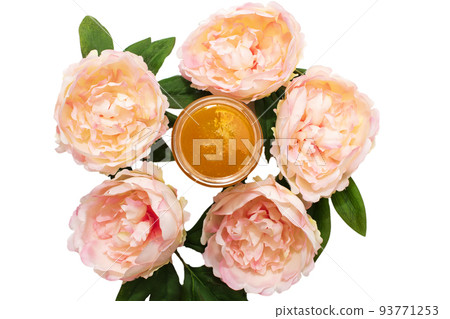 Liquid sugar paste for hair removal in a bowl with peony flower and feather on white background. Liquid sugar paste for hair removal in a bowl with peony flower and feather on white background. 93771253