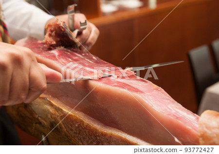 Spanish Iberian ham cut in a restaurant 93772427