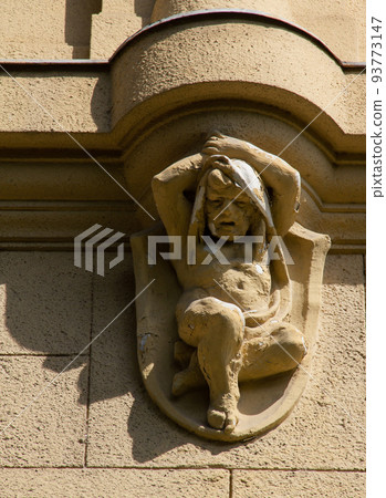 Eroded building sculpture child balcony support with shadow. 93773147