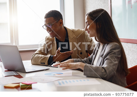 Businesspeople working together in modern coworking, sitting at desk Businesspeople working together in modern coworking, sitting at desk 93775077