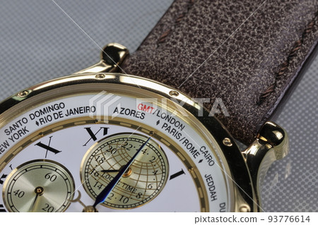 close up on Time zone cities name on luxury world time watch bezel on GMT, london, Paris, Rome, Azores, Rio de janeiro, Santo Domingo, Cairo. close up on Time zone cities name on luxury world time watch bezel on GMT, london, Paris, Rome, Azores, Rio de janeiro, Santo Domingo, Cairo. 93776614