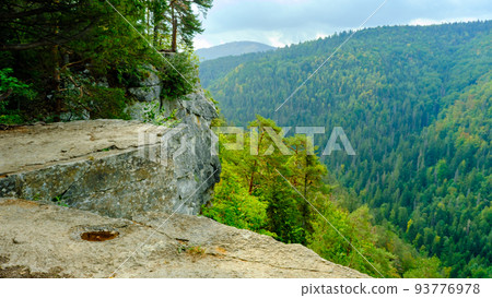 A view of the most beautiful mountains in a panoramic scene. View from Tomasovsky Vyhlad in Slovak Paradise National Park. A blue haze is in the air. 93776978